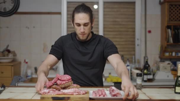 Meat Lover Plays Front Kitchen Counter Top Full Meat Bite — ストック動画