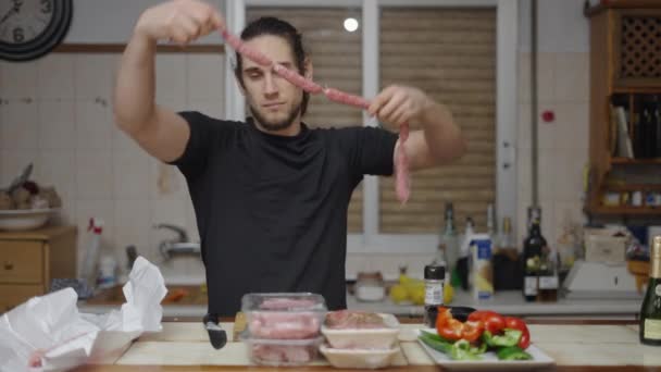 Goofy Young Adult Having Fun Playing Raw Sausages Traditional Spanish — Video Stock