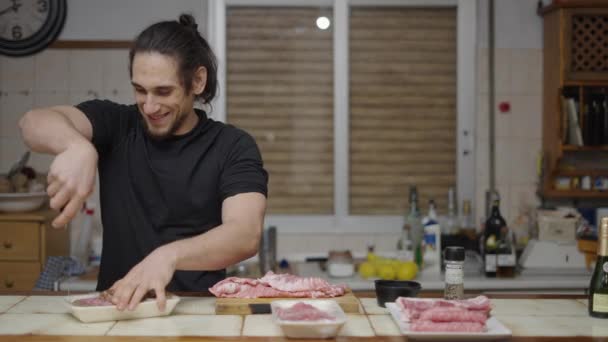 Playful Man Preparing Burger Meat Making Funny Bite Gestures Camera — Wideo stockowe