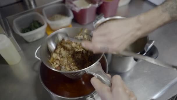 Close View Male Chef Hands Straining Sauce Pot Kitchen Horizontal — Stock Video