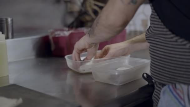 Tattooed Male Chef Hands Place Fish Fillets Container Close View — Vídeos de Stock