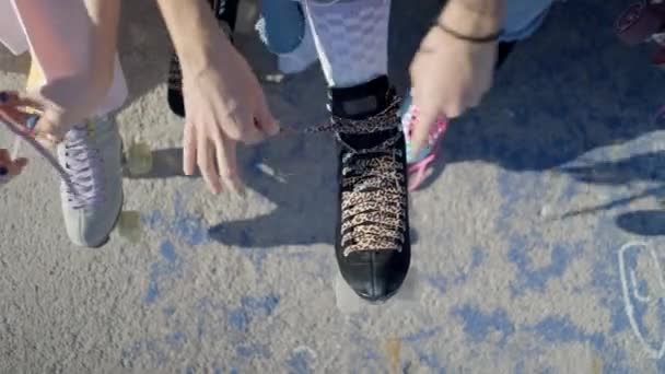 Overhead View Young Women Hands Tying Laces Retro Rollerskates Horizontal — Video