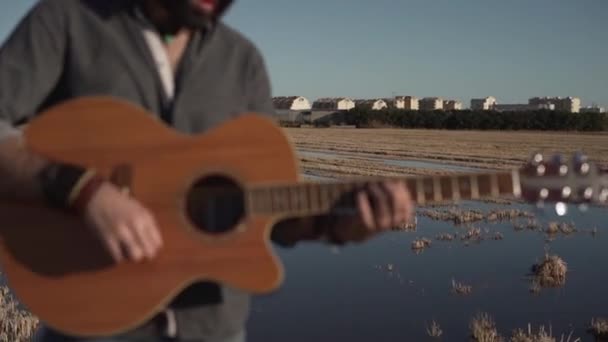 Detail Hands Playing Guitar Singer Rural Landscape Horizontal Video — Stockvideo