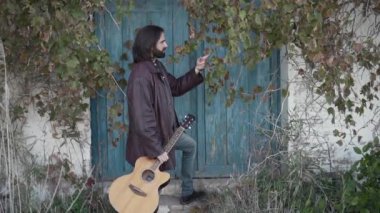 Relaxed man touching green leaves and enjoying the nature in spanish rural area - Horizontal video