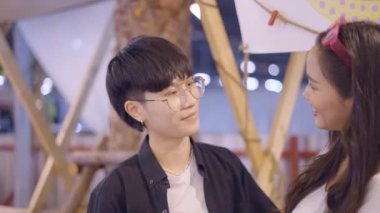 A girl wearing black shirt is staring at her female partner in fascination and it shows signs of their deep love - 4K Horizontal video