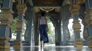 Girl Walking Inside Beautiful Old Temple In Bangkok, Thailand - Medium shot - 4K Horizontal video