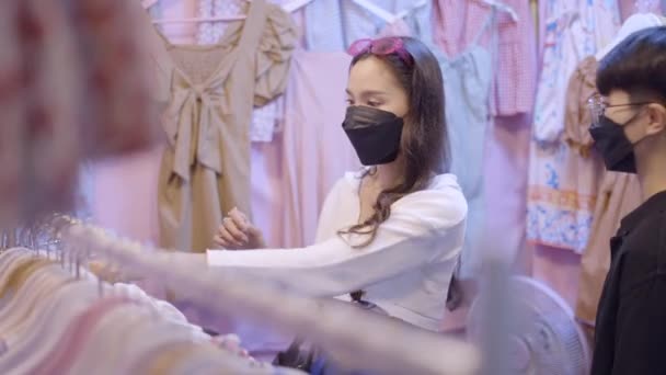 Couple Looking Clothes Cloth Store Both Wearing Black Masks One — Stock video