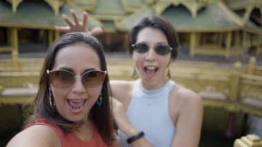Happy Asian Women Having Fun And Taking Selfies At Ancient City Near Bangkok, Thailand. Close Up Shot - 4K Horizontal video