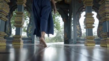 Barefooted Lady Inside The Temple At the Ancient City In Bangkok, Thailand. Low Angle Shot - 4K Horizontal video