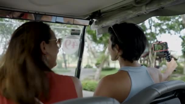 Tourist Women Riding Golf Cart Taking Video Smartphone Medium Shot — Stock video