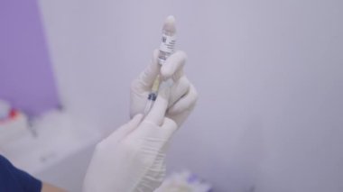 Unknown woman hands extracting solution from vial in private clinic in Bangkok - 4K Horizontal video