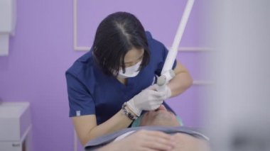 Man gets laser treatment to remove nasolabian fold wrinkles - laser device - 4K Horizontal video