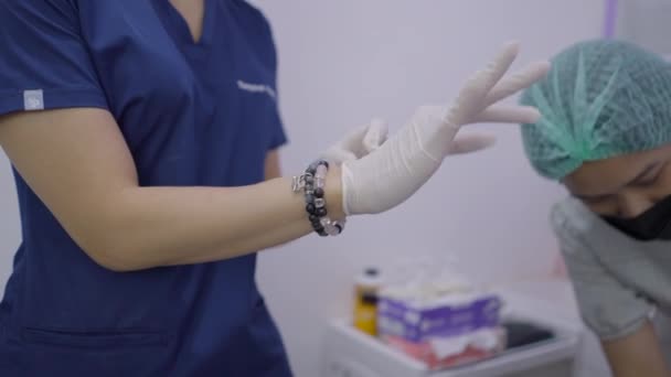 Faceless Doctor Puts Gloves Performing Aesthetic Treatment Beauty Clinic Horizontal — ストック動画