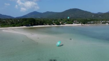 Tourists Into Watersports At The Summer Paradise In Ko Pha Ngan Island, Thailand. Aerial Drone Orbiting - 4K Horizontal video