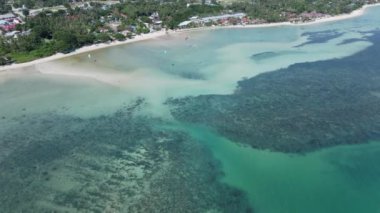 Flying On Turquoise Beach In Ko Pah Ngan Island With Paragliding Tourist In Southeast Thailand. Aerial Drone Shot - 4K Horizontal video