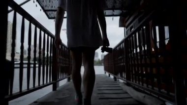 Photographer With DSLR Camera Walking In The Dock At Chao Phraya River In Thailand. - rear, follow - 4K Horizontal video