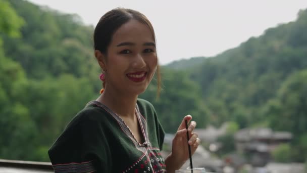 Beautiful Asian Woman Smiling Camera Drinking Cold Beverage While Admiring — стокове відео