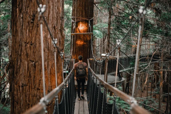 Caucasian Boy Backpack Sandals Brown Shirt Walking Backwards Narrow Walkway — Stock Photo, Image