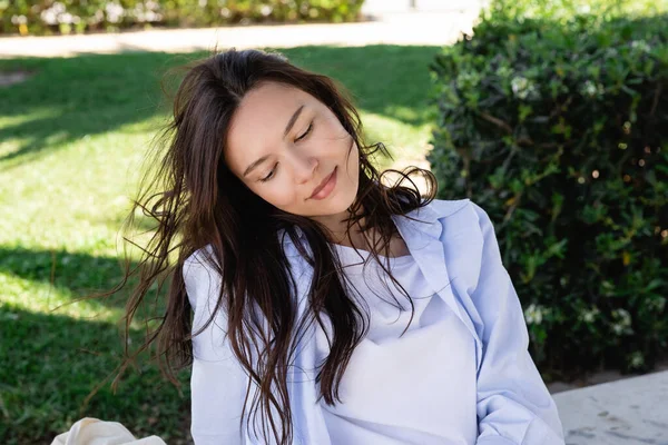 Dreamy Brunette Woman Blue Shirt Smiling Park — 스톡 사진