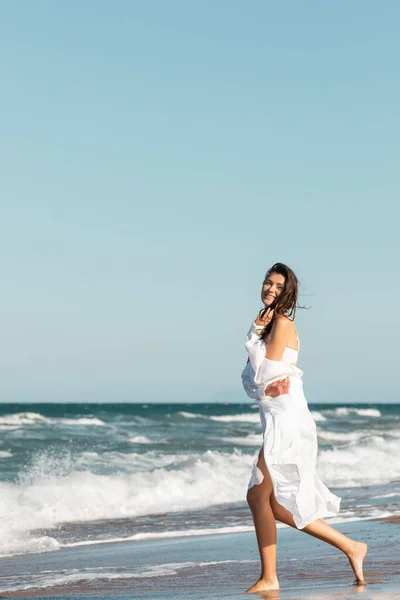 Full Length Joyful Woman White Shirt Swimsuit Smiling Ocean Beach — Stock Photo, Image