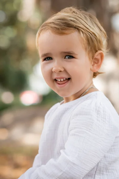 Portrait Cheerful Baby Girl Dress Looking Camera Outdoors — Φωτογραφία Αρχείου