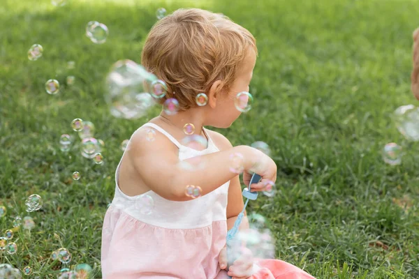 Side View Baby Girl Dress Holding Soap Bubbles Summer Park — Zdjęcie stockowe