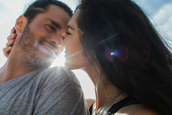 Portrait of cheerful woman looking at pleased and bearded boyfriend — Stock Photo