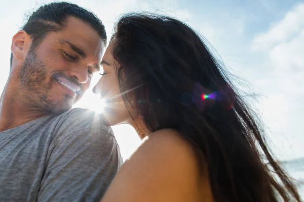 Portrait of happy woman with closed eyes near pleased and bearded boyfriend — Stock Photo