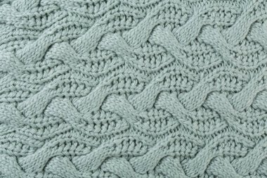 Büyük örgü kumaşlar, büyük desenler, yeşil pastel renkler, yakın çekim, düz yatış.