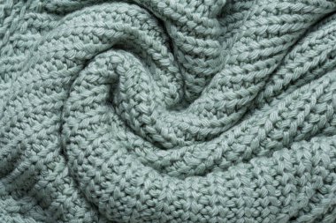 Büyük örülmüş kumaş, mavi-yeşil pastel renk, daire şeklinde bükülmüş, makro fotoğraf, düz yatış