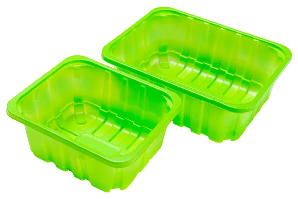 白い背景に2つの緑色のプラスチック製の食品容器が並んで立っていて — ストック写真