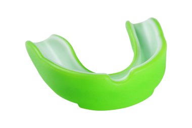 green sports mouth guard, protection of teeth in box of rubber on white background