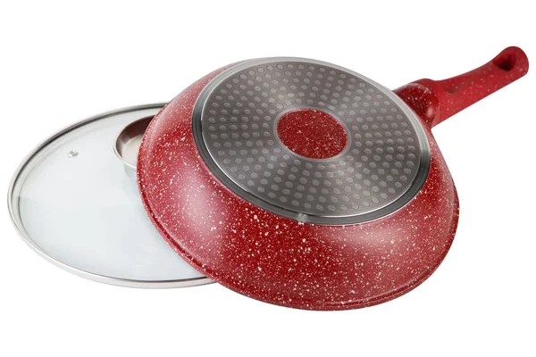 red frying pan with a glass lid, lies upside down, on a white background, isolate