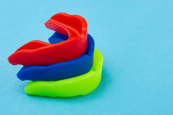 Three Boxing Mouth Guards Blue Red Green Lie One Top — Stock Photo, Image