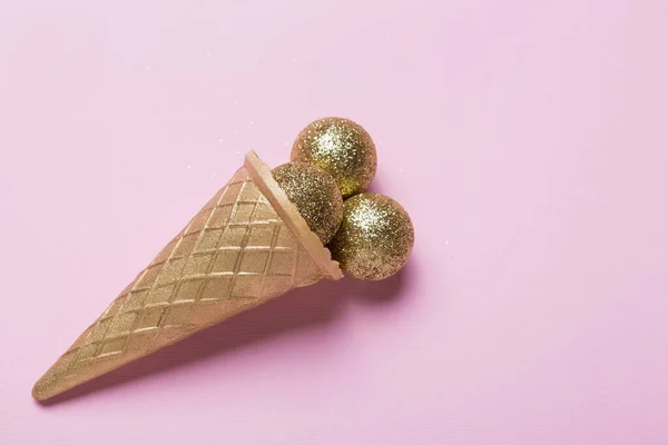 Golden Ice Cream Cone Golden Christmas Balls Pink Background Minimal — Stock Photo, Image