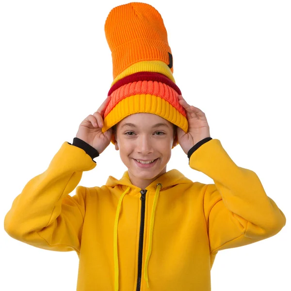 Happy Teenager Boy Yellow Hoodie Five Colored Knitted Hats His — Zdjęcie stockowe