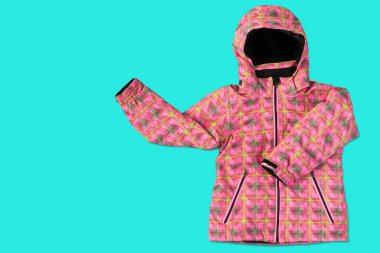 pink women's winter jacket, on a turquoise background, the sleeves seem to show gestures, the concept of seasonal shopping