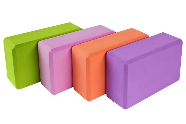 Four Colored Blocks Yoga Lie Side Side Concept White Background — Fotografia de Stock