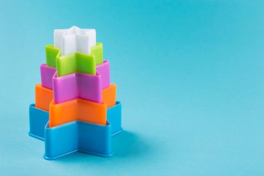 idea of a minimal Christmas concept, forms for baking cookies on a turquoise background