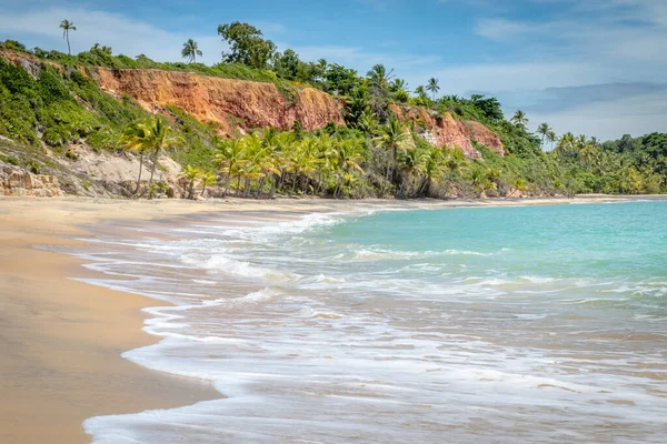 Idyllic and secluded Espelho Beach with sea cliffs in Trancoso, BAHIA