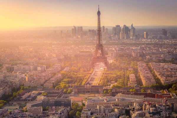 Eiffel tower and parisian roofs at dramatic sunrise Paris, France