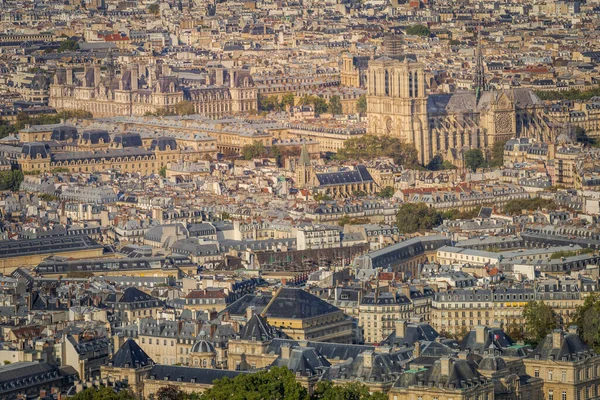 Quarter latin parisian roofs and Notre Dame Cathedral at golden sunrise Paris, France