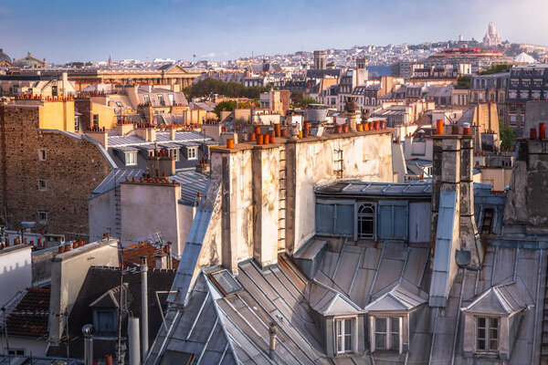 Parisian roofs of Montparnasse and Montmartre at golden sunrise Paris, France