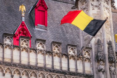 Belgian and euro flags with flemish architecture in Bruges