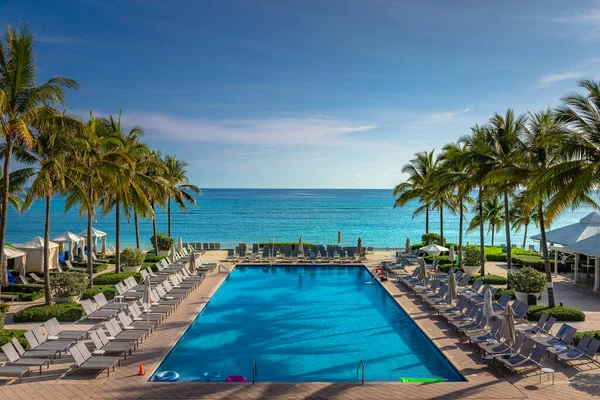 Tropical paradise: caribbean beach with pool, gazebos and palm trees, Montego Bay, Jamaica