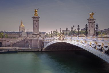 Line of Street lights and Invalides dome in Pont Alexandre III, Paris, france