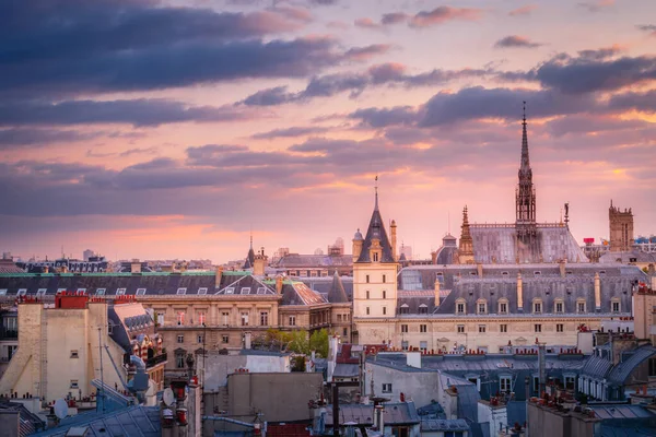 Saint Chapelle and quarter latin parisian roofs at golden sunrise Paris, France