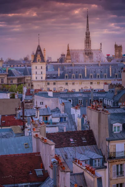 Saint Chapelle and quarter latin parisian roofs at golden sunrise Paris, France