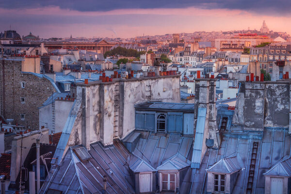 Parisian roofs of Montparnasse and Montmartre at dramatic dawn Paris, France