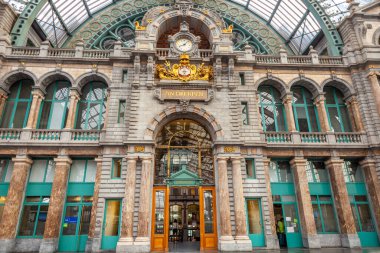 Ornate Antwerp Central Train Station indoors with clock, Belgium